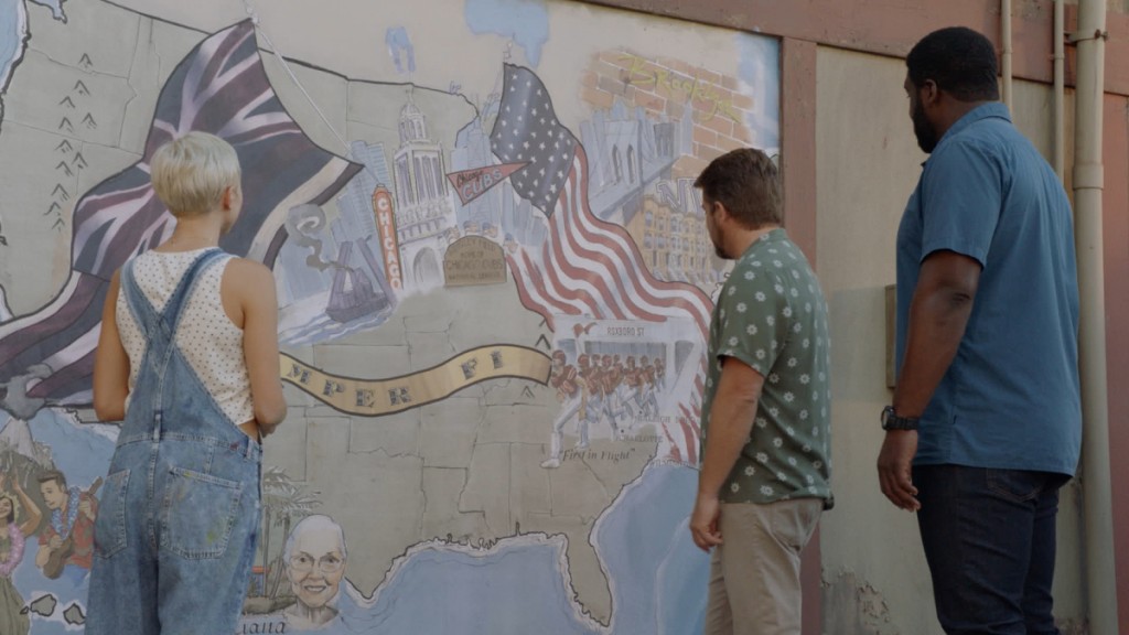 Suzy Madison (Betsy Phillips), Rick Wright (Zachary Knighton) et TC Calvin (Stephen Hill) regardent une peinture murale.